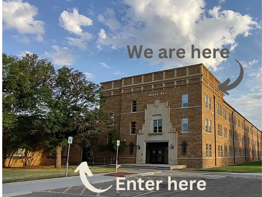 View of Weeks Hall from the South. Enter here + Arrow pointing towards small pair of black doors in the shadows. We are Here + arrow pointing towards the third floor