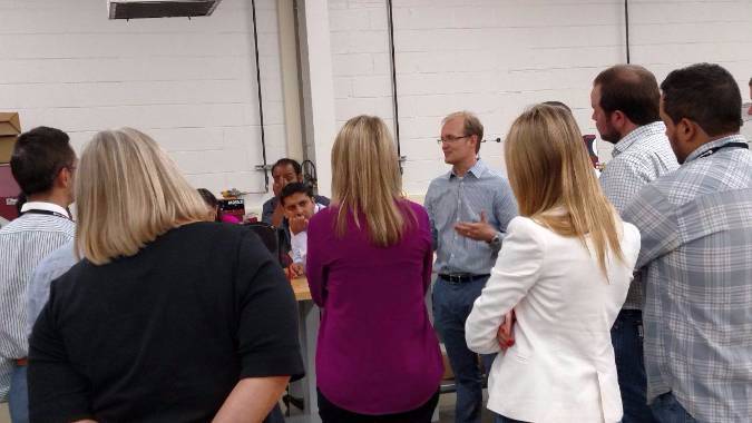 Brendan Kelly leads the Texas International Cotton School tour of the Cotton Phenomics Laboratory