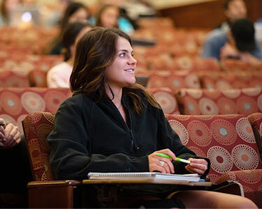 Student Sitting Smiling In Class