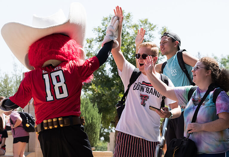 Raider Red High Five Students