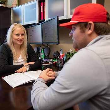 Staff Talking with Student