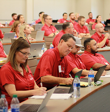Group of students from school baking with red shirt