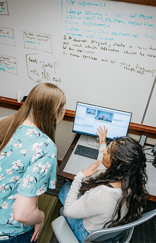 Girl Explaining on Computer