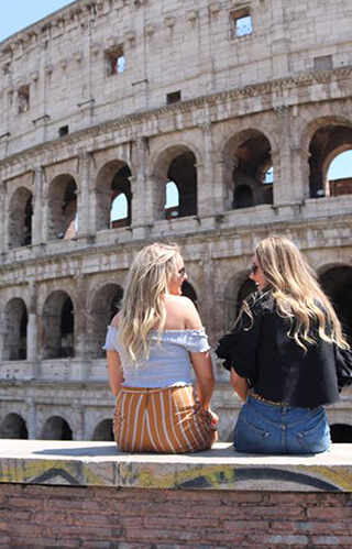 Two Girls Sitting In Rome
