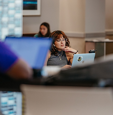 Female student using laptop