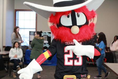 Raider Red and students at the blood drive