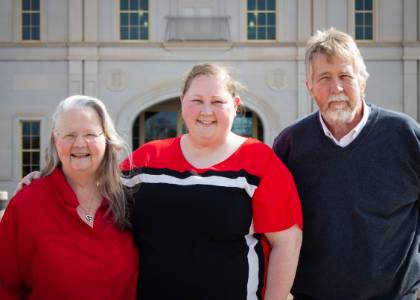 Collins family in front of Rawls College