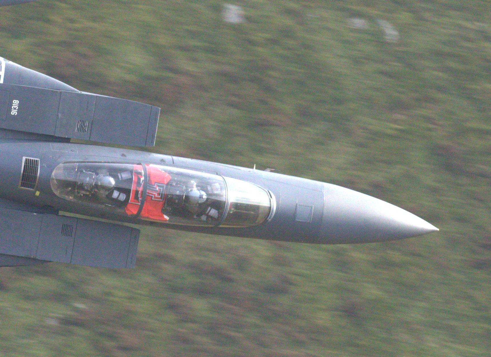Placeholder Image Capt. Scott Hicks proudly displays the flag of his alma mater in his cockpit while flying through the Mach Loop. Photo courtesy of Andrew Doggett.