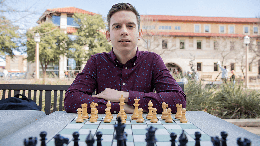 Evgeny Shtembuliak playing chess at Texas Tech.