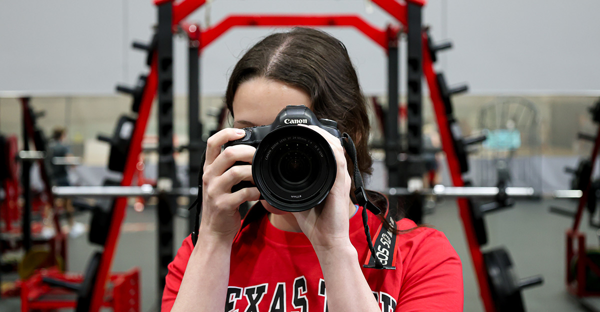 Media Policy Woman holding a camera up to her face