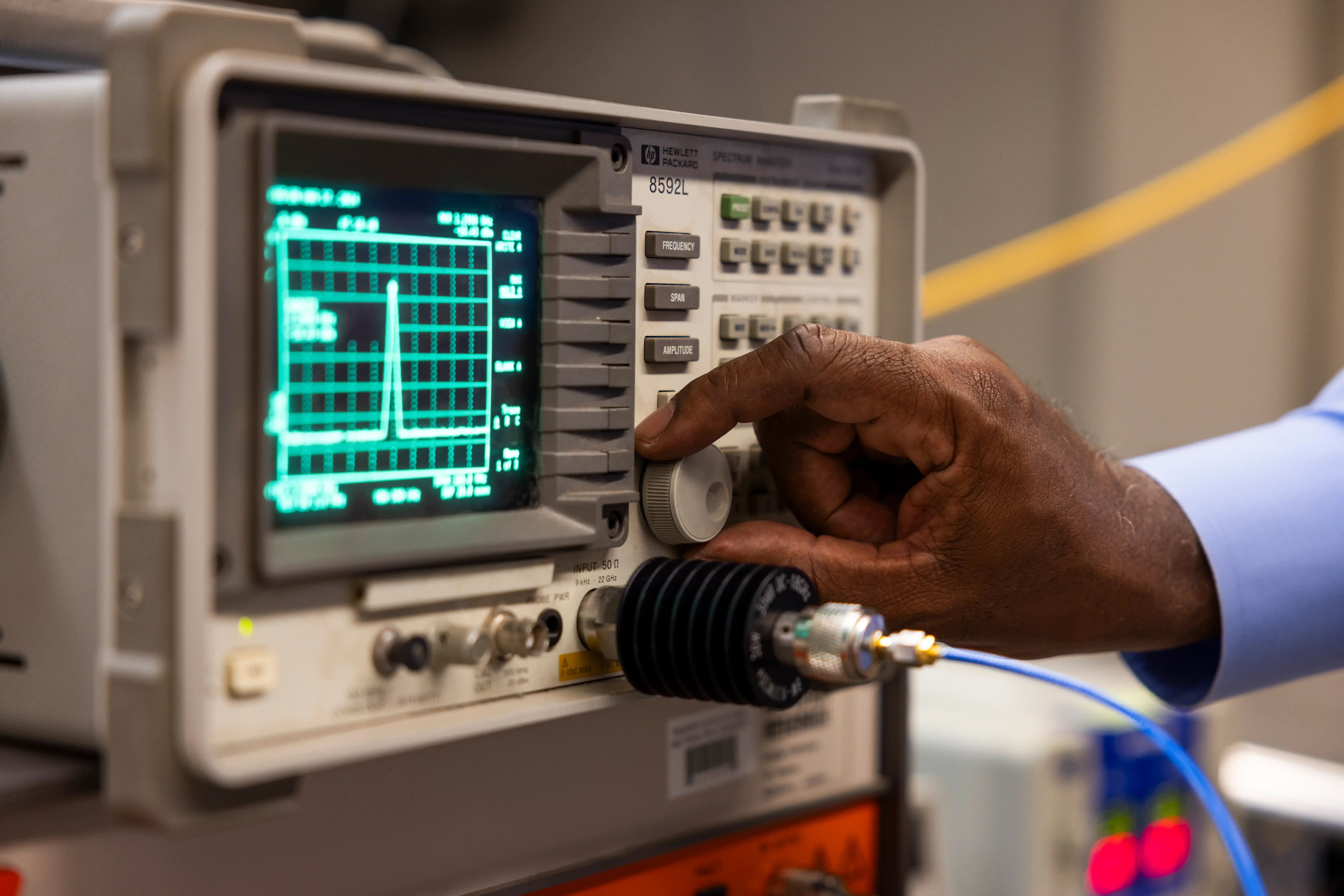 Stephen Bayne operating a machine