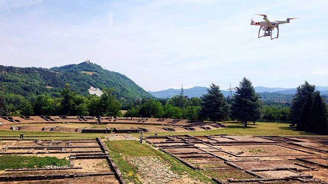 drone flying over partially excavated portion of Libarna