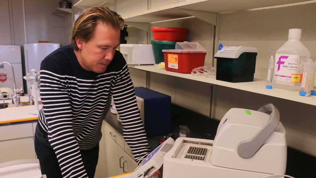 Texas Tech researcher Caleb Phillips conducting research in the lab.