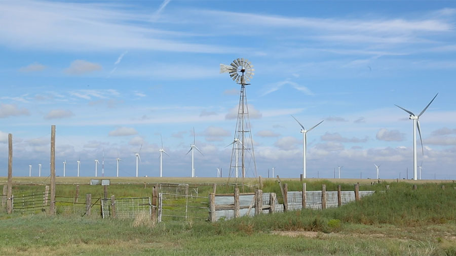 windmill with wind turbines in background