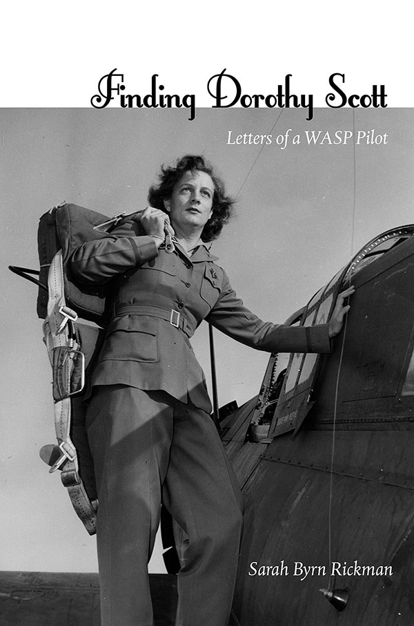 cover. black and white photo of dorothy scott entering plane