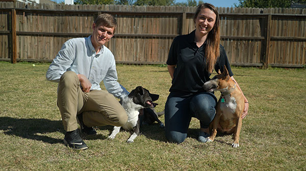 Nathan Hall, left, his dog Bessa, Sasha Protopopova and her dog Sonya