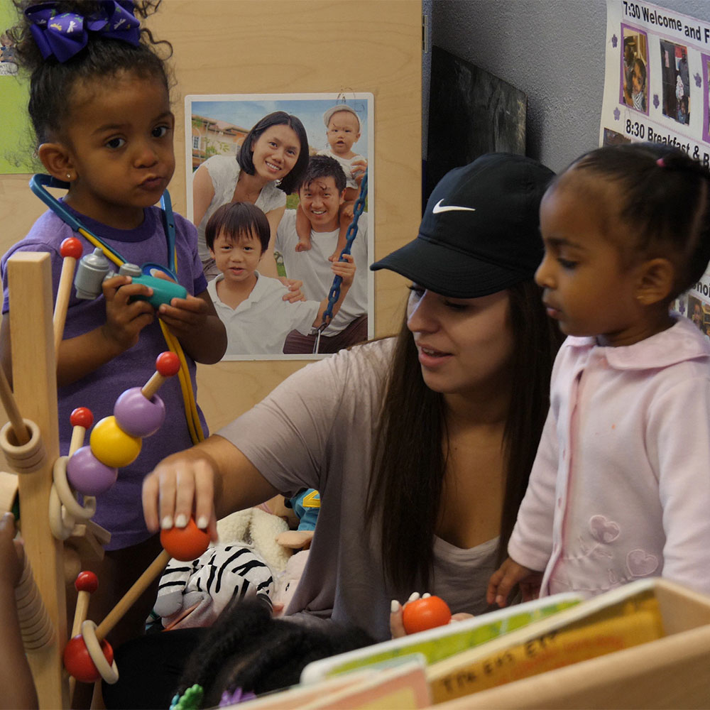 students play with teacher