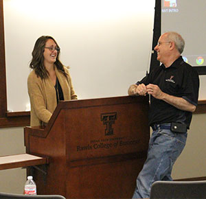 mitchell with student at podium