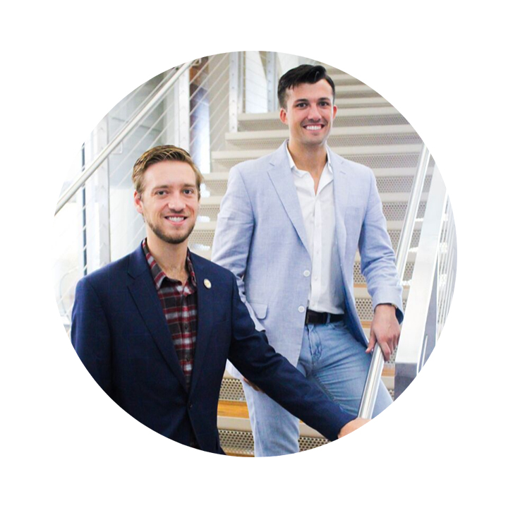 James Bunch (left) and Patrick Bettiol stand on the Innovation Hub staircase