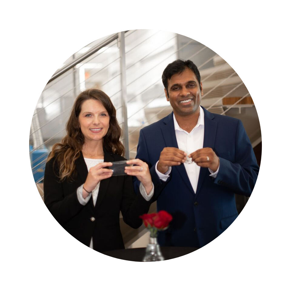 Magdalena Rawkowska and Balaji Rao hold small devices at the Texas Tech University Innovation Hub 