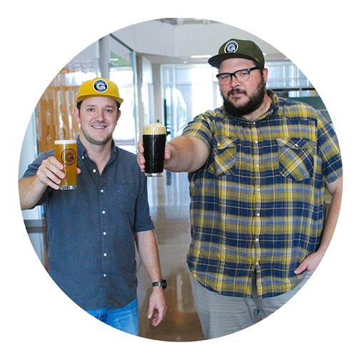 Good Line Beer Company co-founders Shawn Phillips (left) and Chris Troutman (right) hold glasses of beer at the Hub Good Line Beer Company co-founders Shawn Phillips (left) and Chris Troutman (right) hold glasses of beer at the Hub