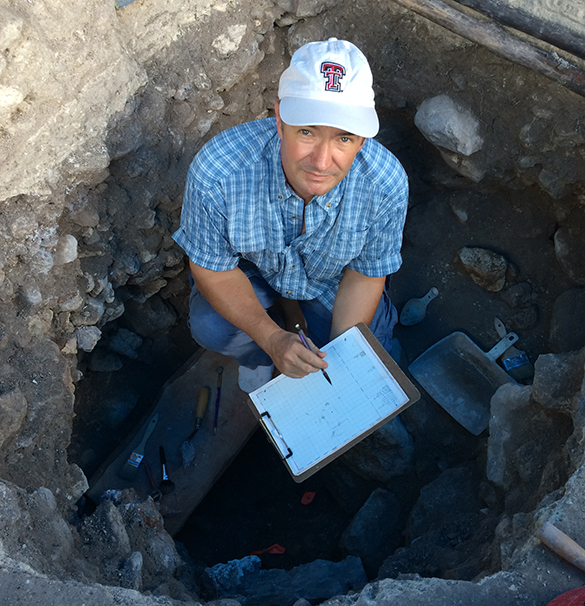 Recording a burial at Chan Chich, Belize