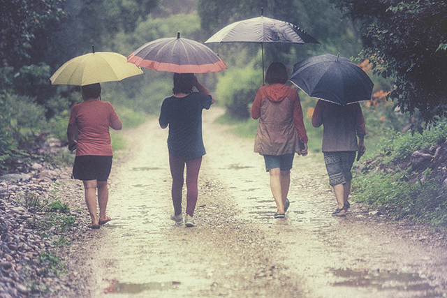 a man walking in the rain