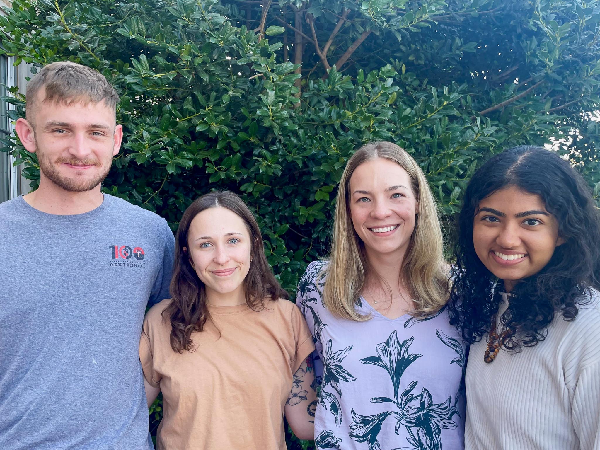 a group photo that includes 4 smiling therapists