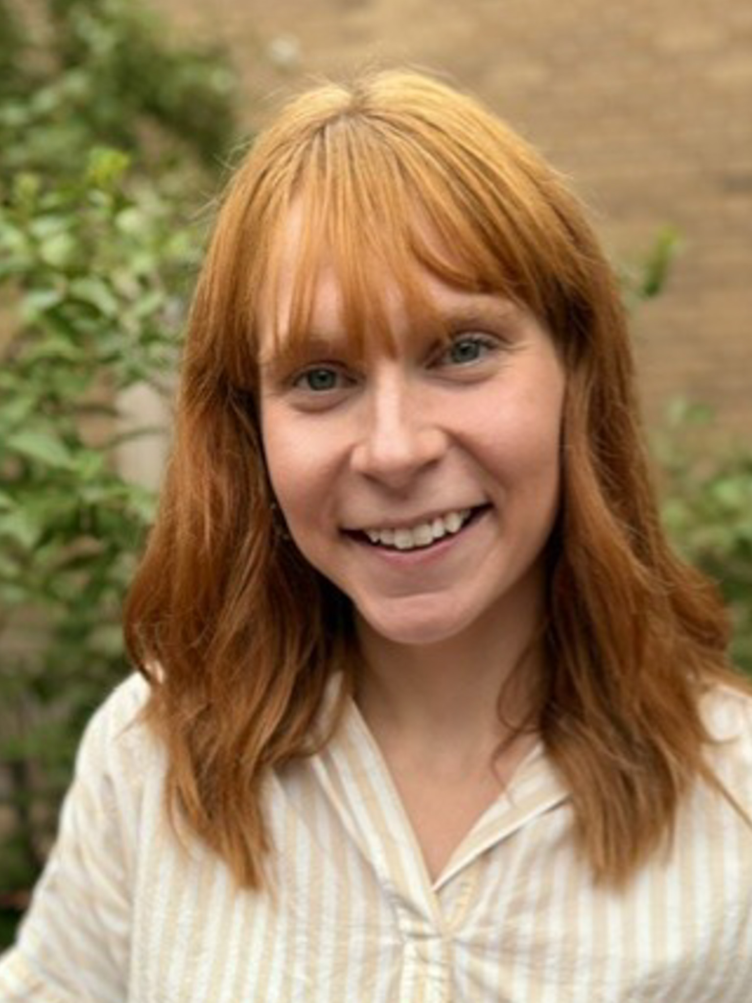 Headshot photograph of Cassie