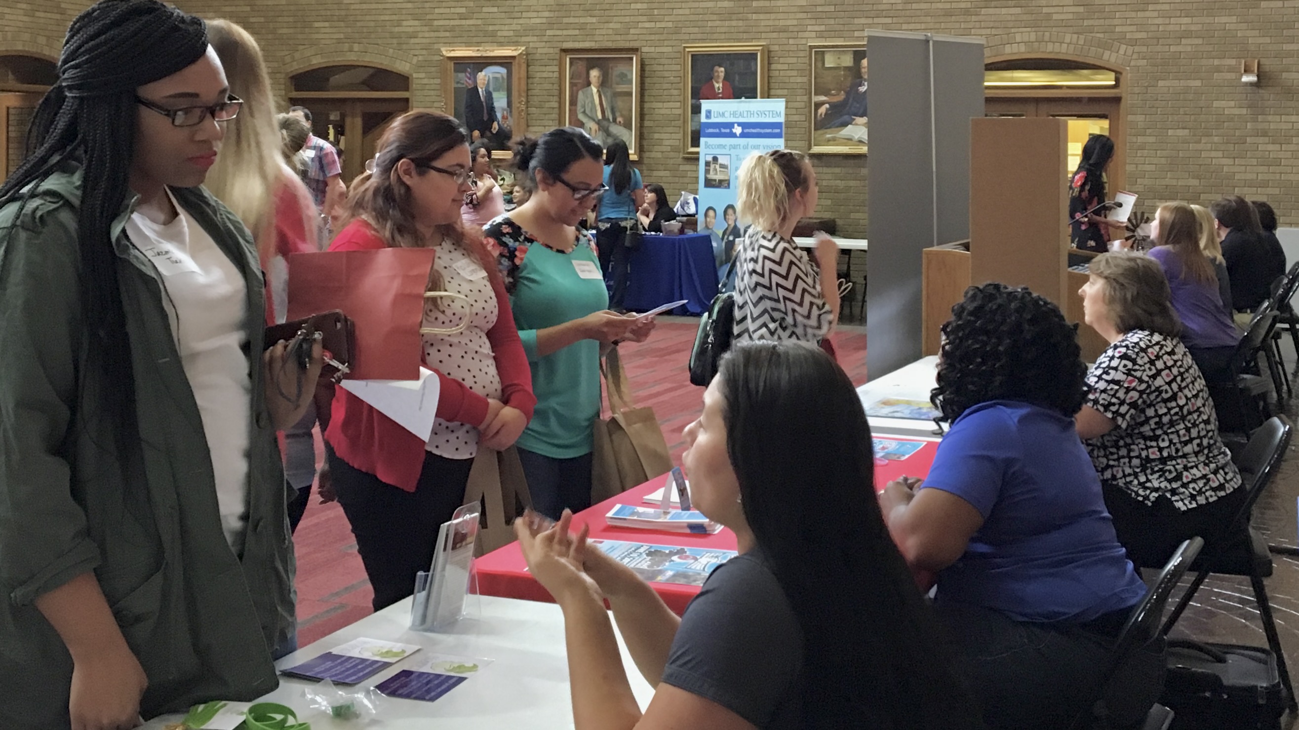 student inquires about agency at 2017 Field Fair