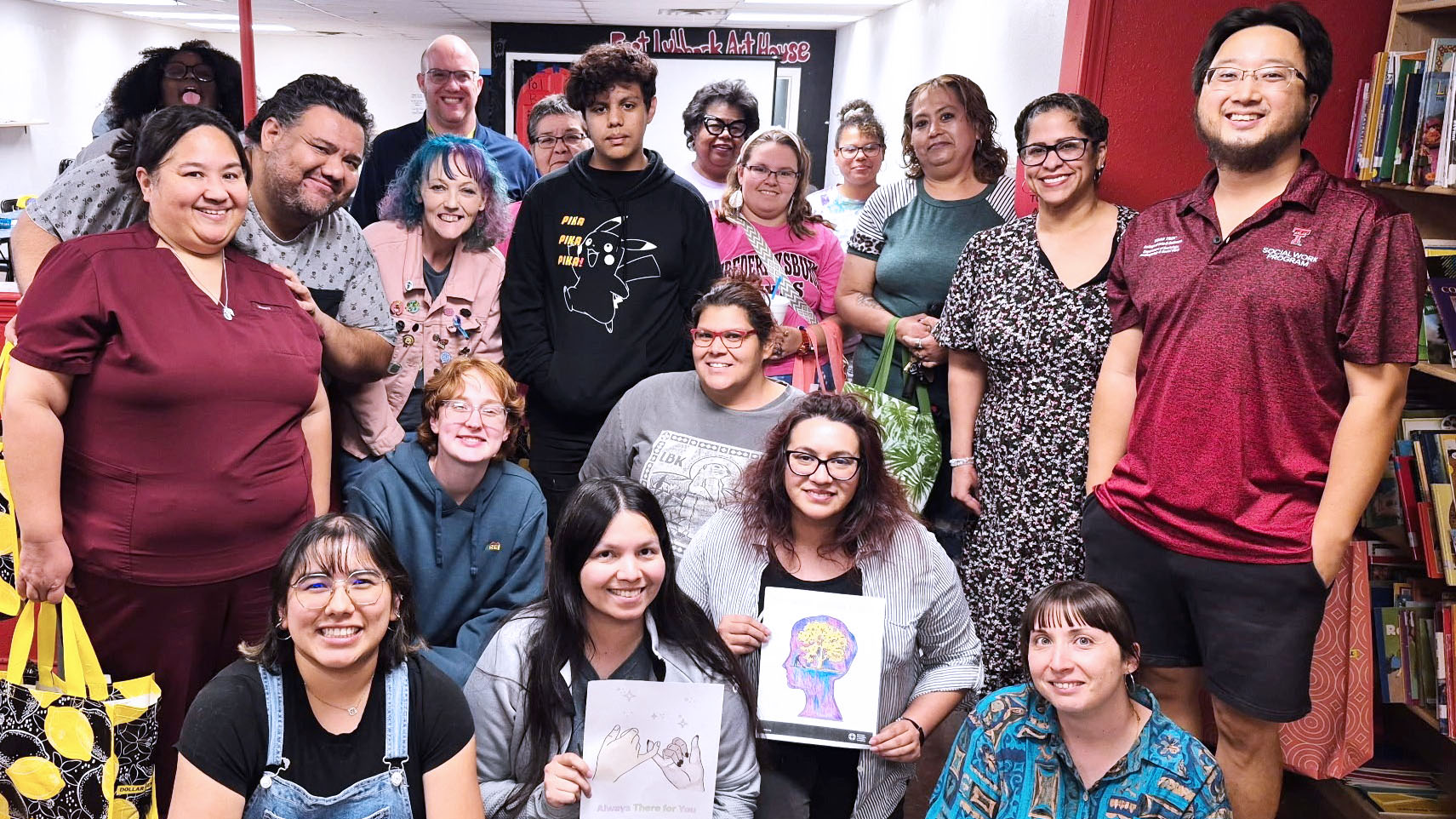 Dr. Cho stands on right posing with attendeees of his community outreach class