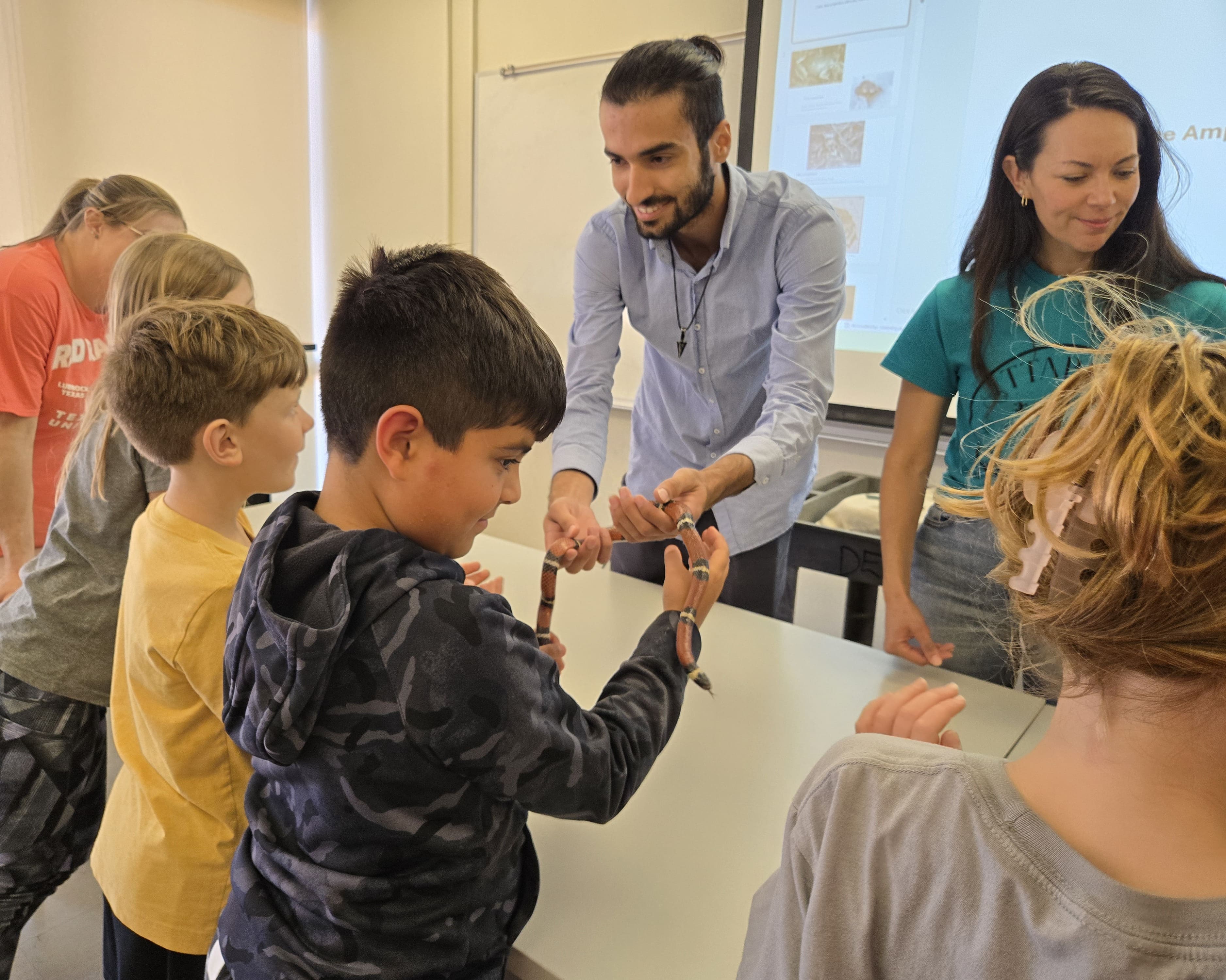 Kid handling snake