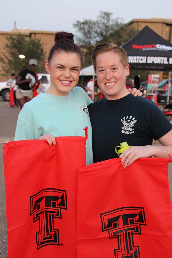 two students holding bags at Hub City Fest