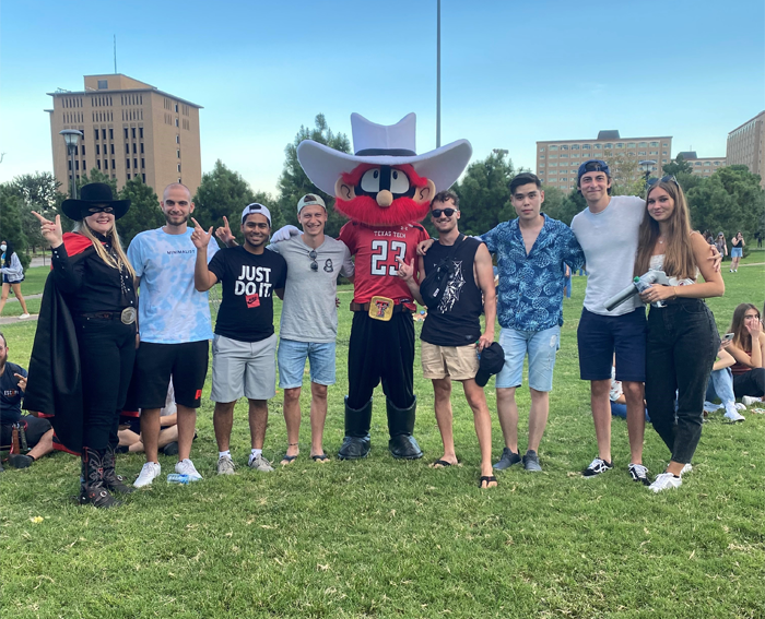 Students with Raider Red and Masked Rider