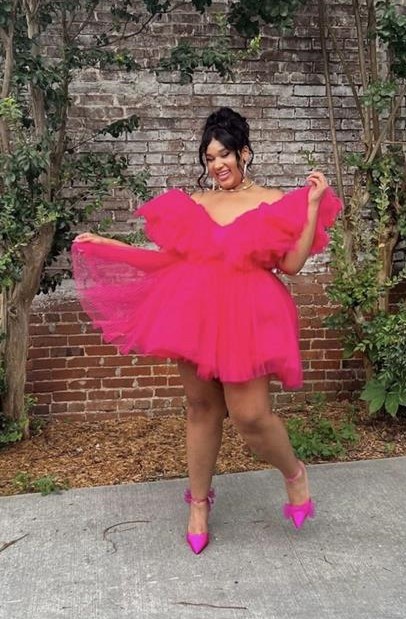 ChrisLynne, Transfer Ambassador, poses in pink
