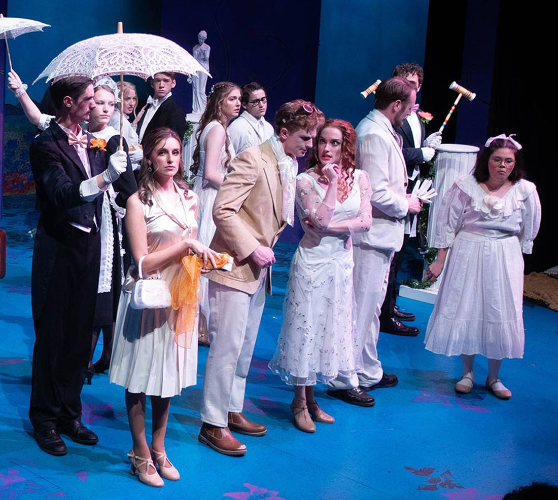 TTU Theatre students in dress clothes on stage