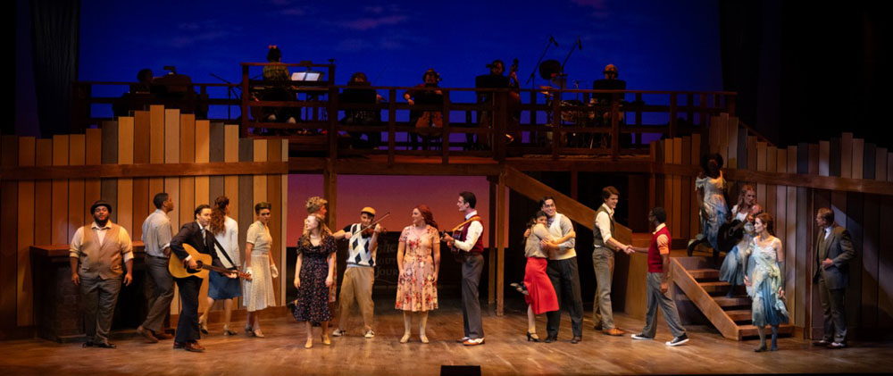 Full cast onstage after a performance