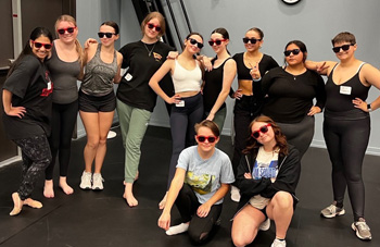 TTU theatre students on-stage posing in sunglasses