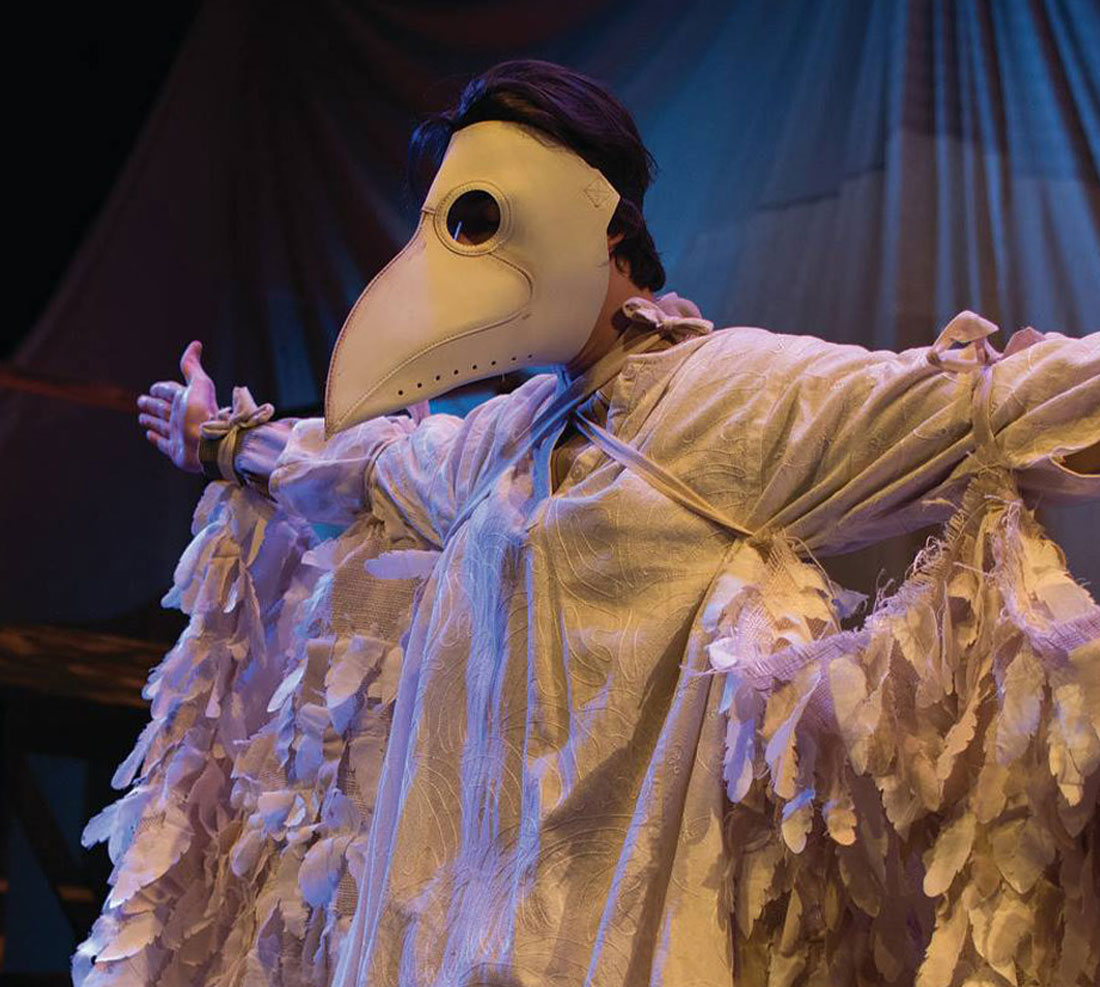 TTU student in bird costume on-stage