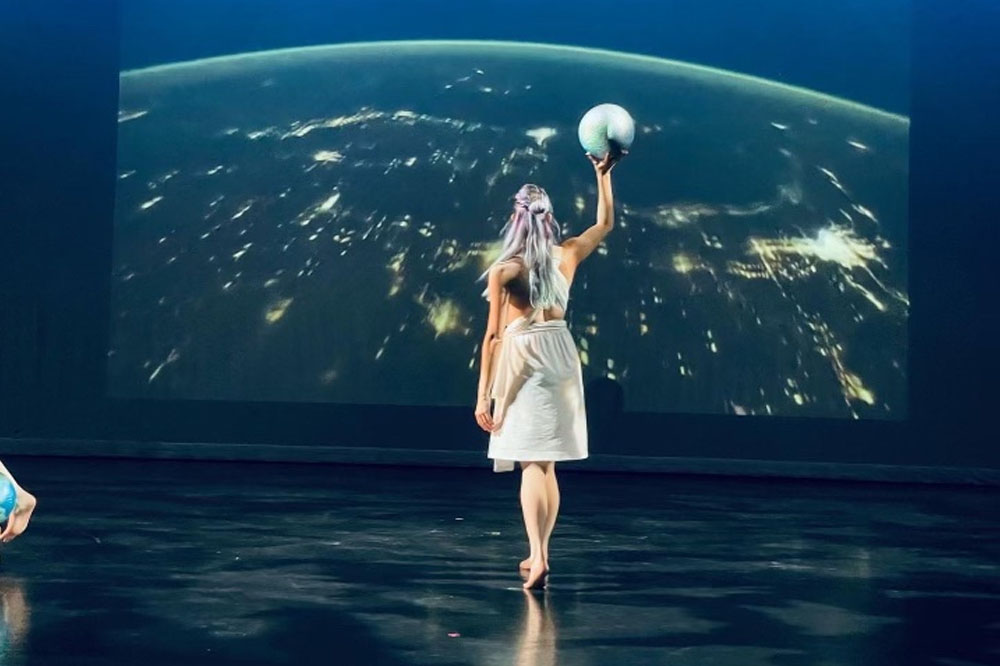 TTU Dance faculty member, Katrina Soricelli performing with Flatlands Dance Theatre in collaboration with the Schools of Theatre and Dance and Music; lighting by John Conner; photography by Melissa Pihos