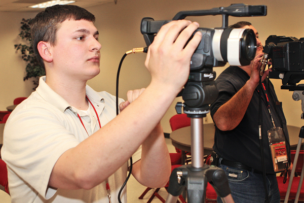 student using a video recorder