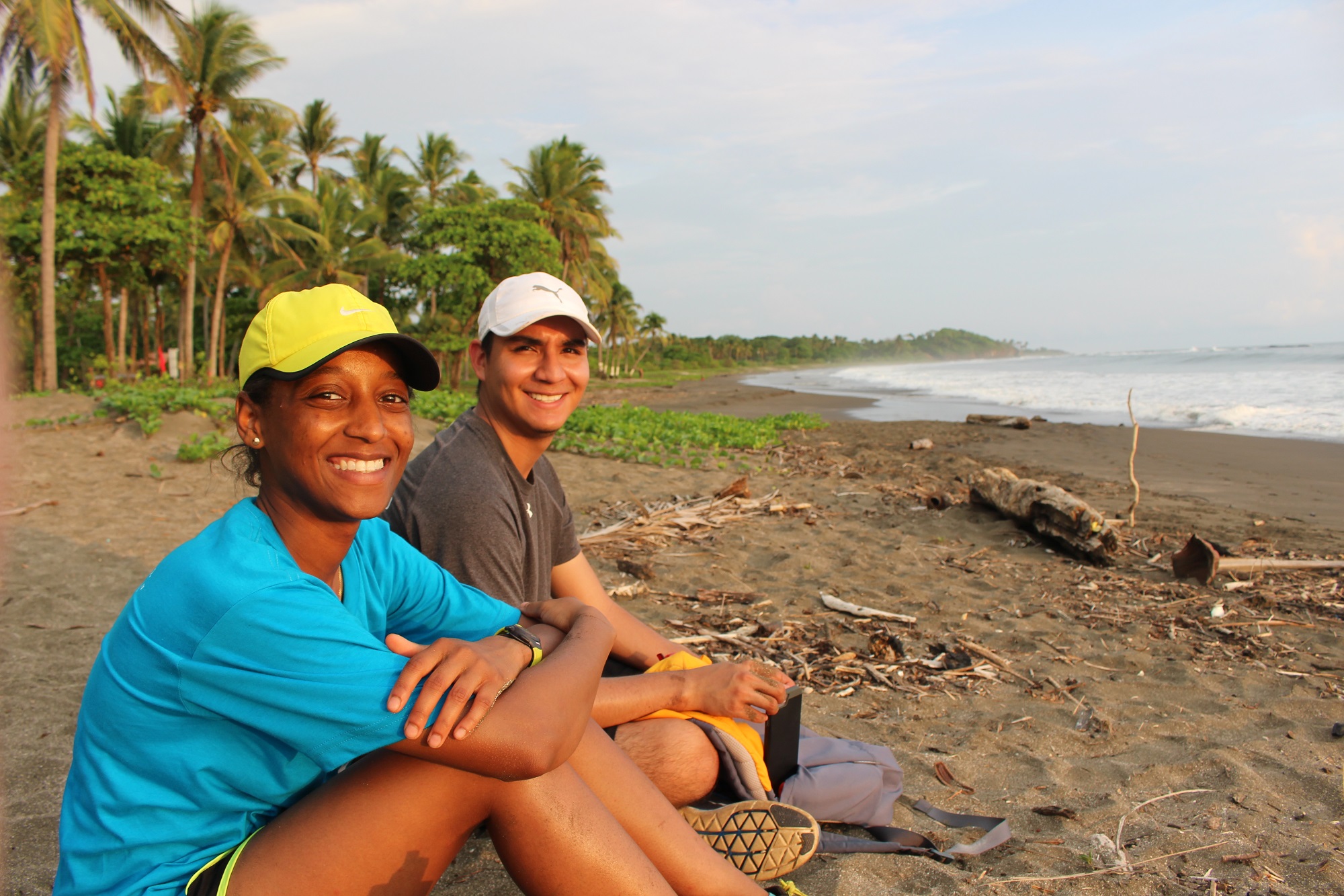 2 ttu studnets sit on the beach