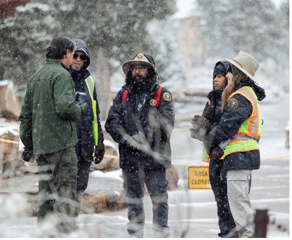 A group of people standing in the snow