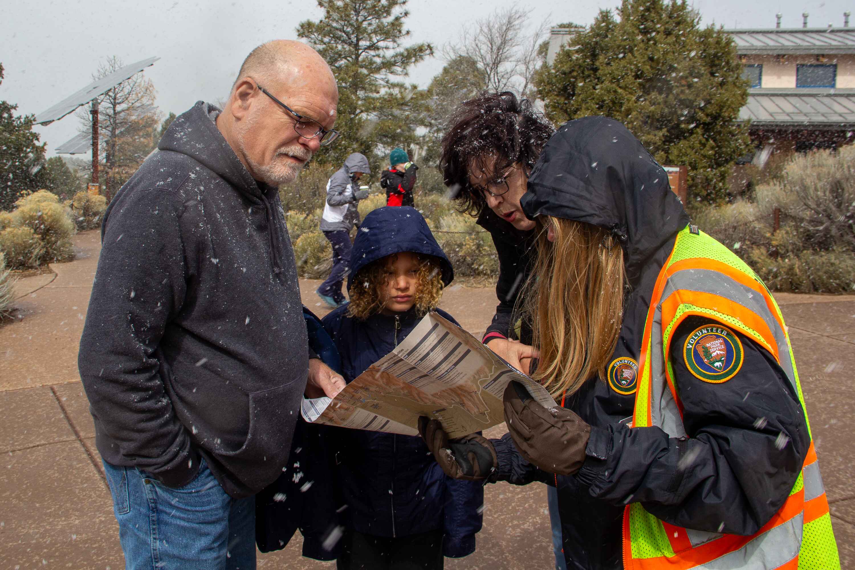 Taylin assisting visitors on the trial map