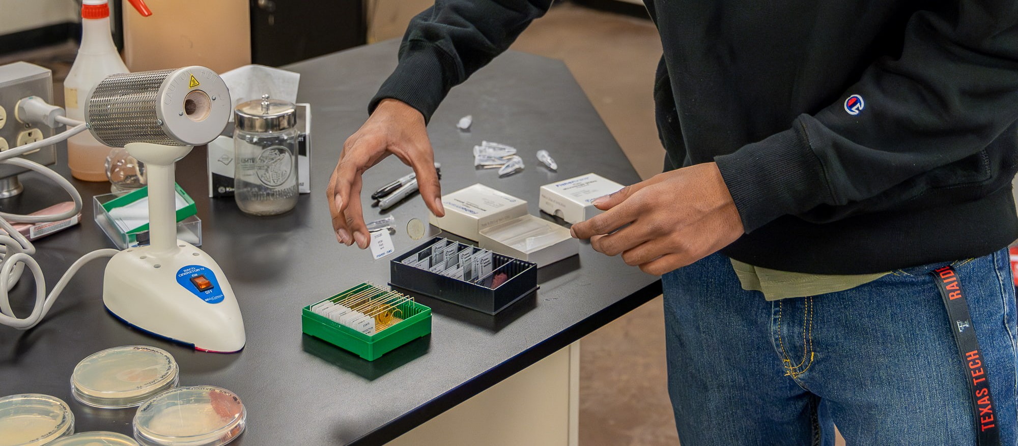 Photo of student looking in microscope