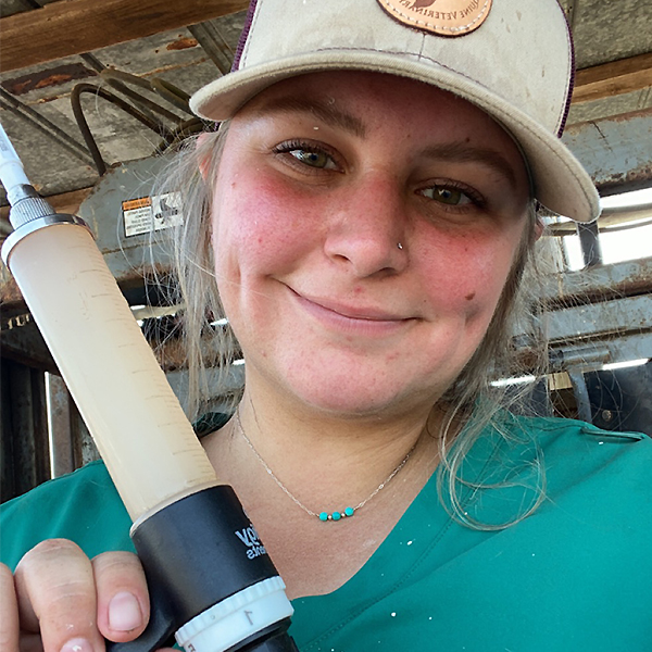 Katlyn Marr working cattle