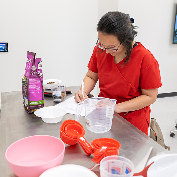 Maryana Orduna Measuring Dog Food 