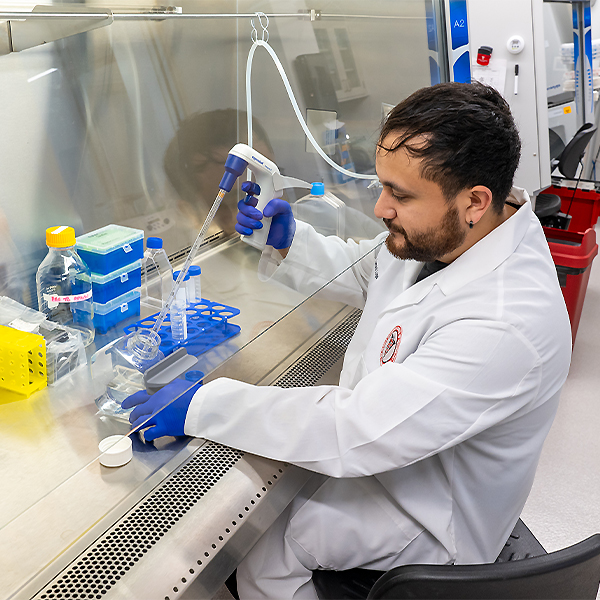 Tomas Lugo working in research lab