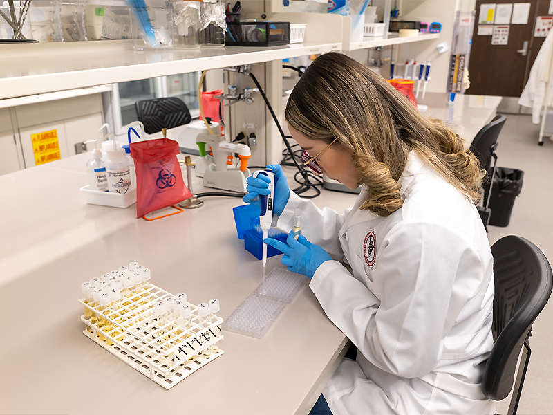 Maria Salazar working research lab