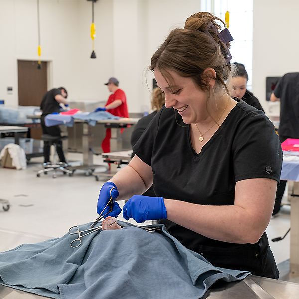 Kayla practicing skills on a educational model